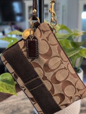 Coach Signature Monogram Wristlet in Brown and Tan